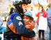 Photo Of Young Boy Hugging Officer At Ferguson Rally Goes Viral And Becomes ‘Icon Of Hope’