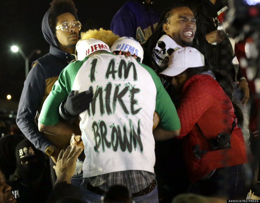 Scenes From Ferguson: Town Shaken By Grand Jury Decision Not To Indict Darren Wilson
