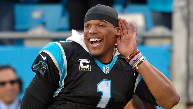 501241228-cam-newton-of-the-carolina-panthers-listens-to-the-fans