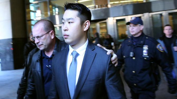 463195194-new-york-city-police-officer-peter-liang-is-escorted