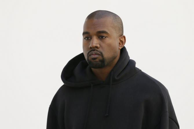 465349300-american-rapper-kanye-west-poses-before-christian-dior