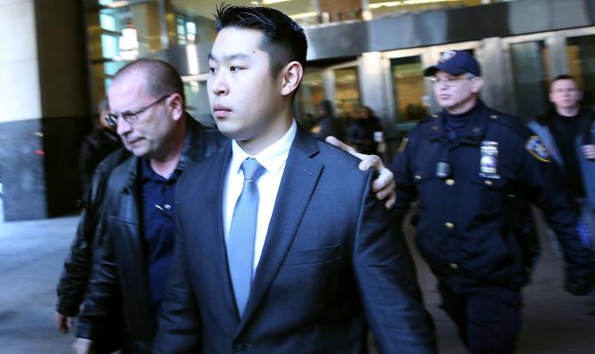 463195194-new-york-city-police-officer-peter-liang-is-escorted