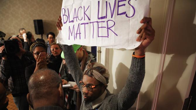 505837498-black-lives-matter-protester-is-kept-out-of-the-main