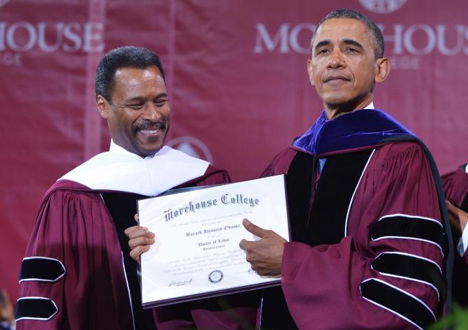 169056863-president-barack-obama-shows-his-honorary-doctorate-of