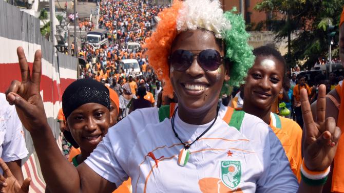 463064536-supporter-of-ivorian-football-national-team-wearing-a