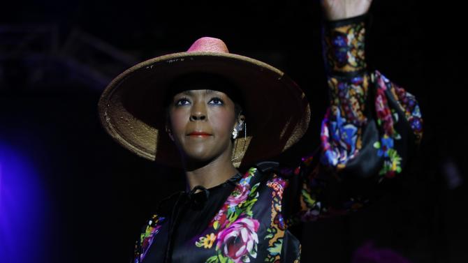 480205236-singer-lauryn-hill-acknowledges-applausw-on-stage