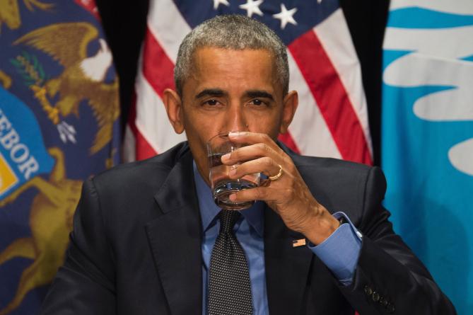 528215470-president-barack-obama-drinks-filtered-water-during-a