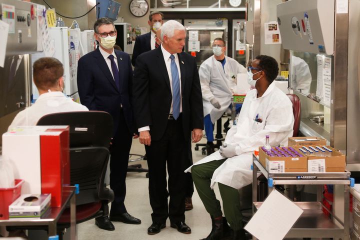 Vice President Mike Pence visits the molecular testing lab on April 28 at the Mayo Clinic in Rochester, Minnesota. Pence chose not to wear a face mask, an apparent violation of the medical center's policy.