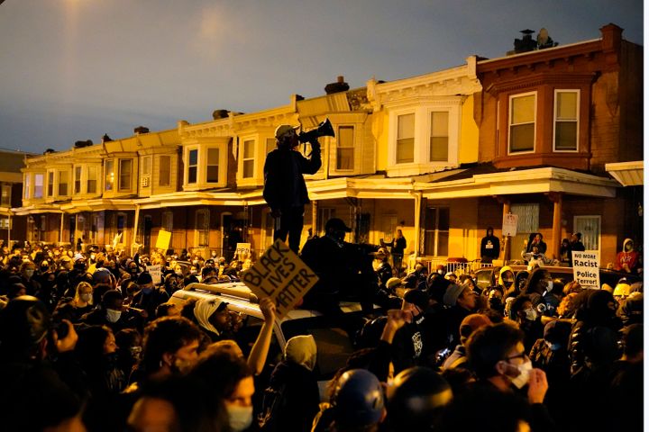Protesters confront police during a march Tuesday Oct. 27, 2020 in Philadelphia. Hundreds of demonstrators marched in West Ph