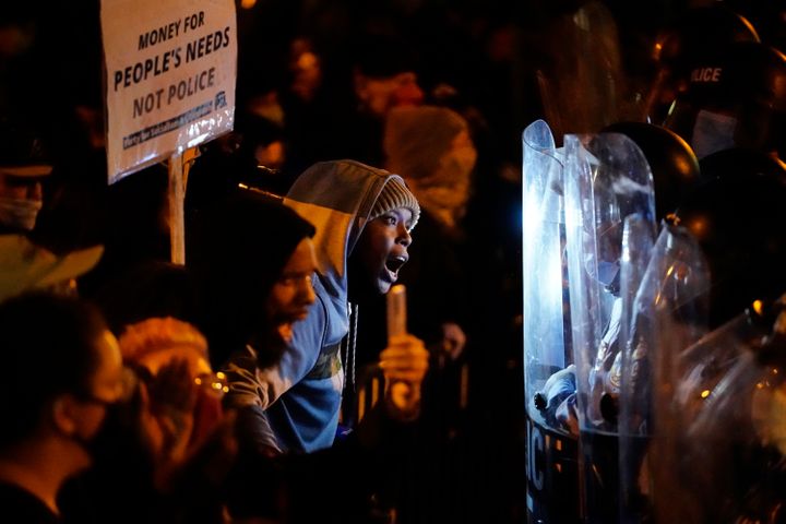 Protesters confront police during a march, Tuesday, Oct. 27, 2020, in Philadelphia. Hundreds of demonstrators marched in West