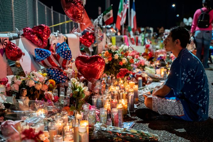 Abel Valenzuela visits the makeshift memorial for victims of the mass shooting at the Cielo Vista Mall Walmart in El Paso, Te