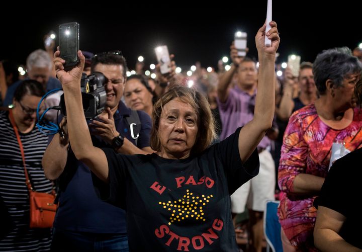 People attend a prayer vigil for the victims of the El Paso massacre. Just 13 hours after that shooting, there was another de