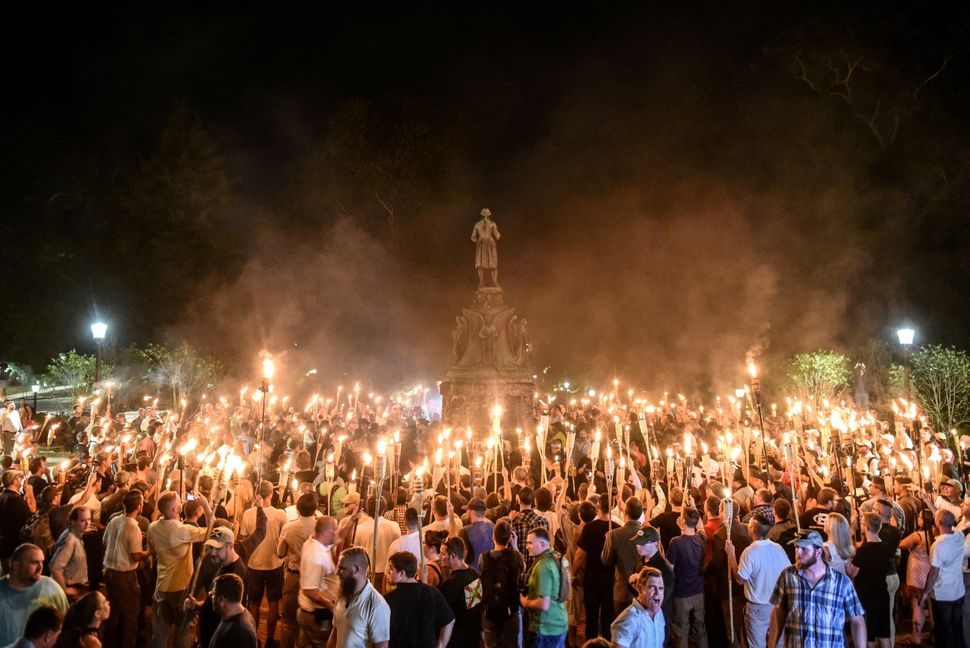 White nationalists participate in a torch-lit march on the grounds of the University of Virginia ahead of the Unite the Right